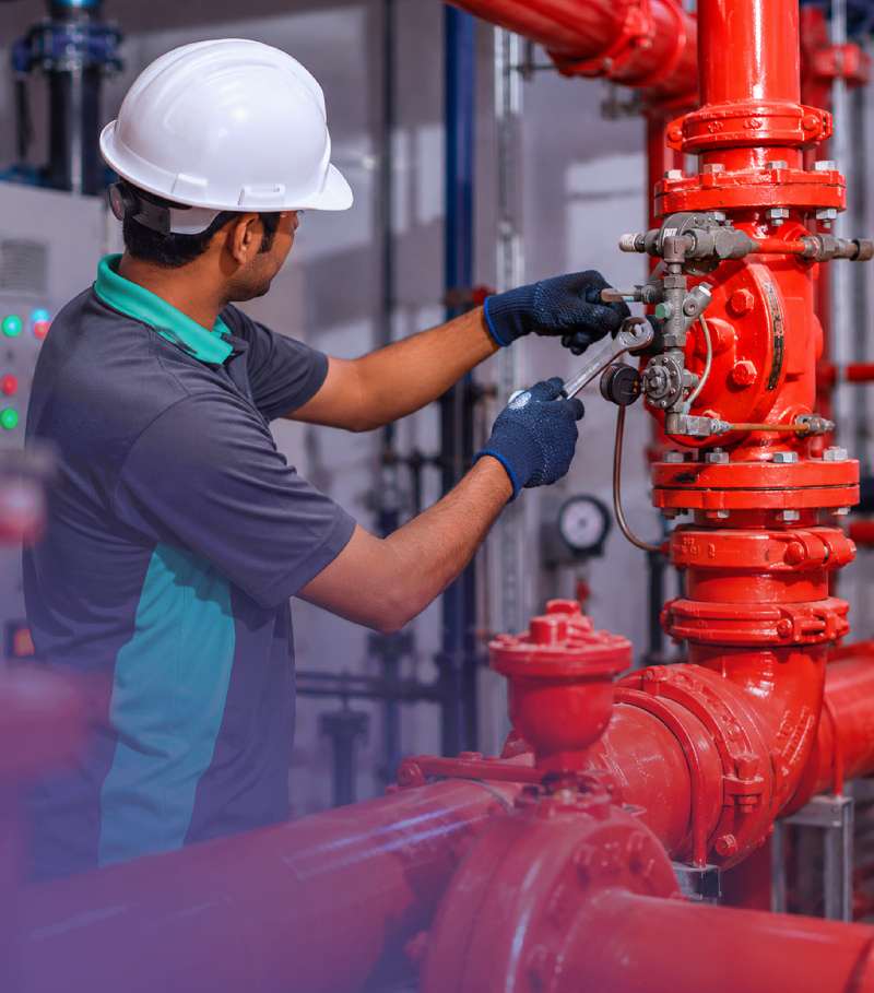 An engineer uses an on demand labour solution uae to inspect industrial water pipes.